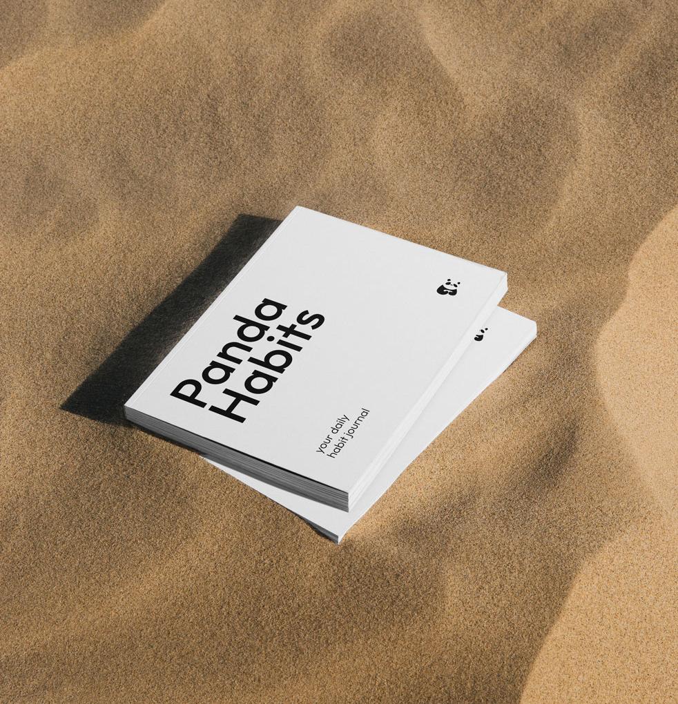 The Panda Habits journal held in hand